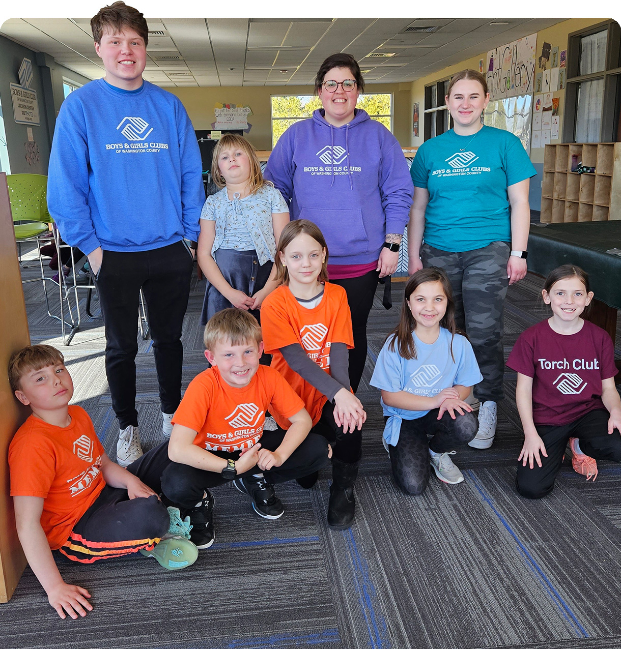 Group of kids and teens in Boys and Girls club t-shirts