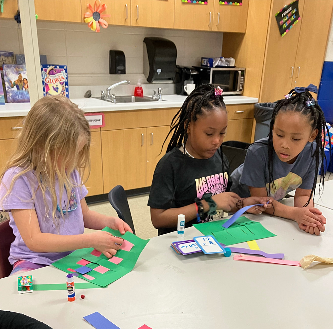 Kids crafting at a craft table.