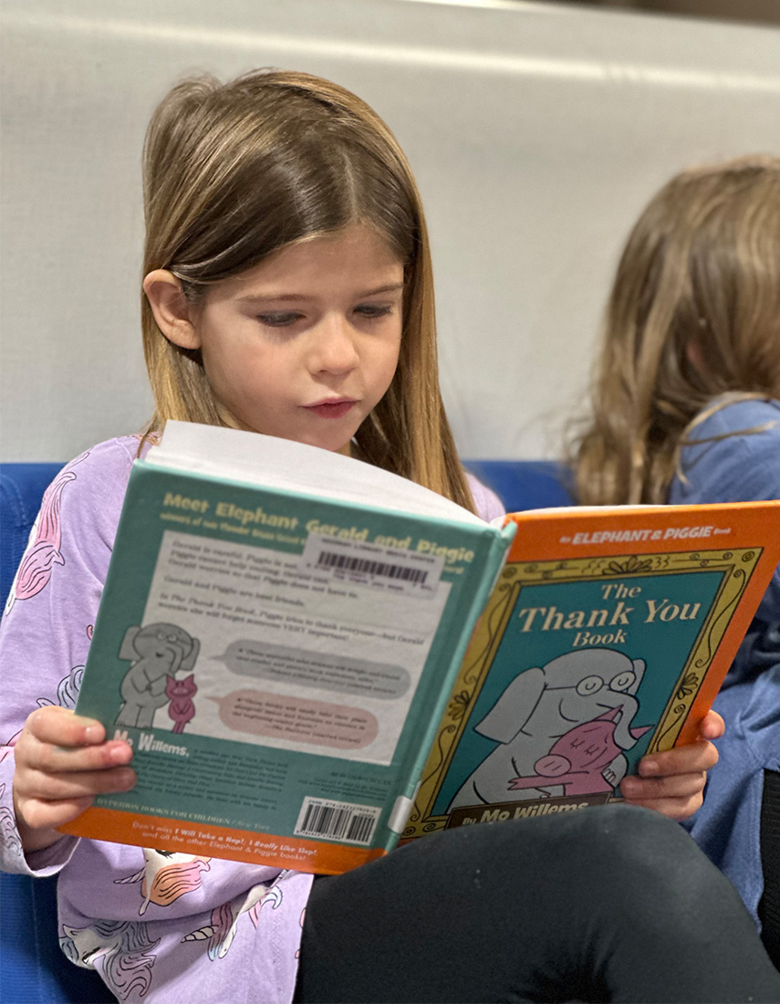 Girl reading a book.