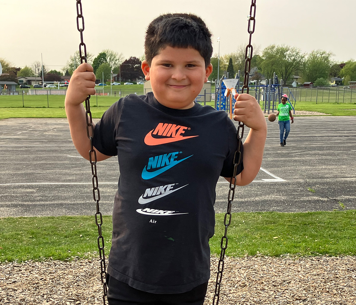 Boy on the swings.